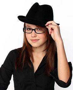smiling woman wearing and holding black hat thumbnail