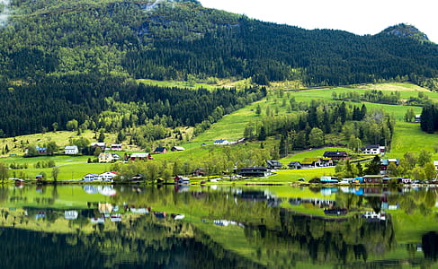 houses near mountains at daytime thumbnail