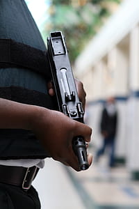 selective focus photo of person holding SMG thumbnail