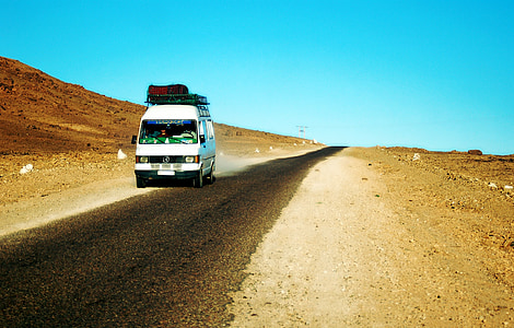 white bus on road at daytime thumbnail