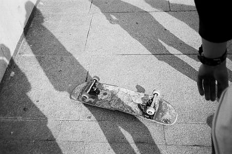 Grayscale Photo of Up-side-down Skateboard thumbnail