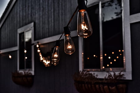 pre-lit string lights hanged on house thumbnail