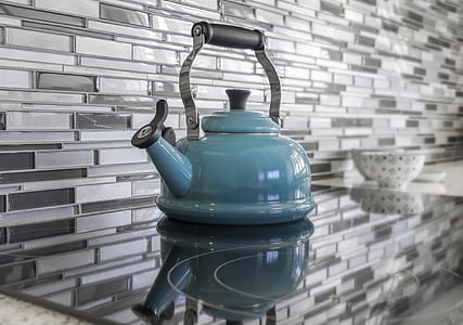 blue kettle on induction cooker thumbnail