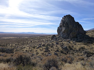 rock formation on grass field during daytime thumbnail