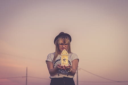 woman holding lantern lamp thumbnail