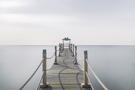 landscape photography of boat dock with calm water thumbnail