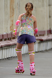 girl playing on the road during day time thumbnail