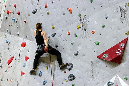 woman hanging on obstacle course thumbnail