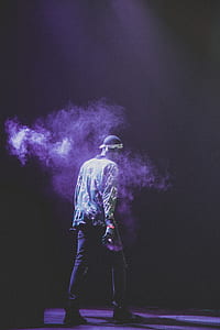 man on stage with smoke thumbnail