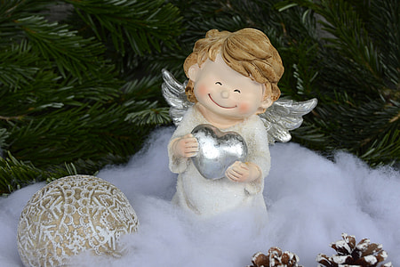 angel figurine holding heart thumbnail