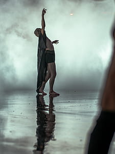 person wearing gray coat and boxer brief looking up thumbnail