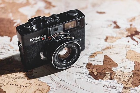 black Konica Camera on map thumbnail