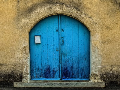 closed blue wooden doors thumbnail