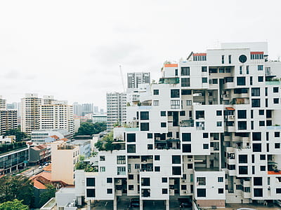 gray concrete building beside road thumbnail