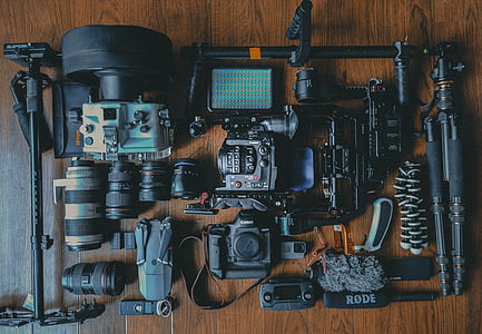 black Canon DSLR camera with stabilizer kit flat lay photography thumbnail