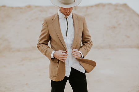 man with brown suit jacket thumbnail