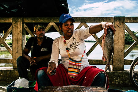woman holding fish thumbnail