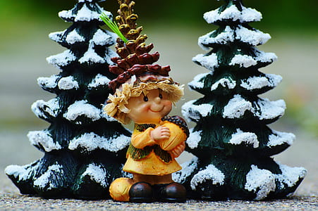 boy holding acorn figurine thumbnail