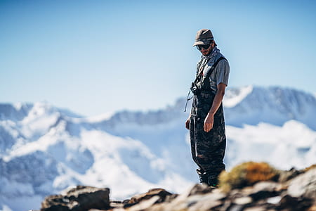 man standing on mountain top thumbnail