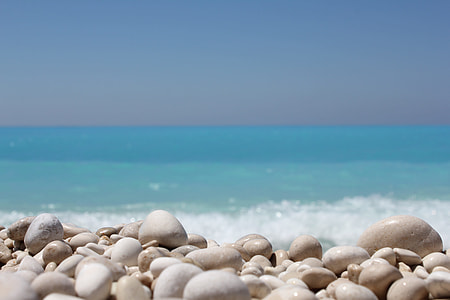 white stones on sea shore during daytime thumbnail