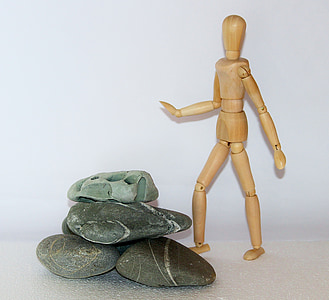 stick figure near pile of stone thumbnail