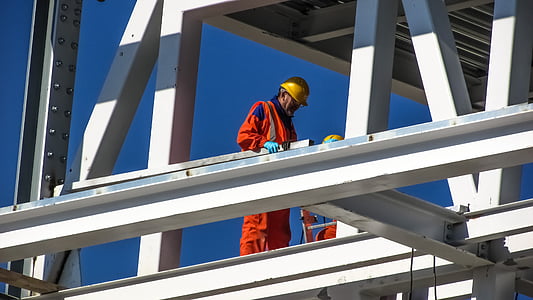 man wearing orange safety suit during daytime thumbnail