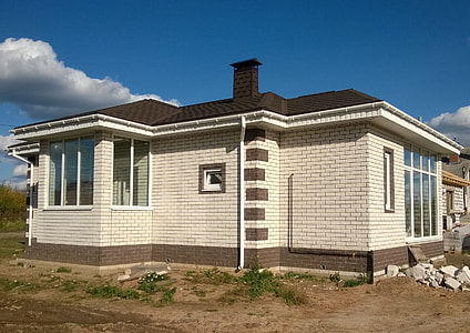 white and black painted house thumbnail