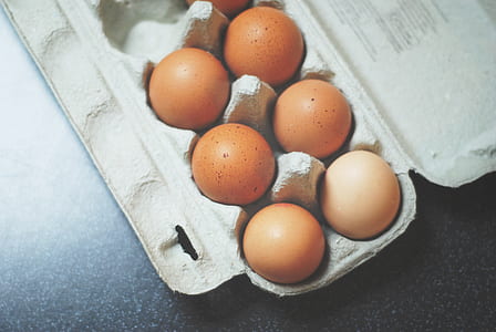 seven brown poultry eggs on egg tray thumbnail