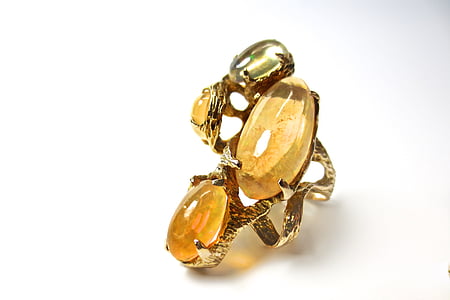 gold-colored ring with brown gemstones thumbnail