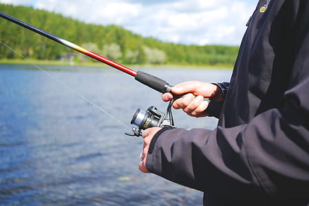 person holding fishing rod thumbnail