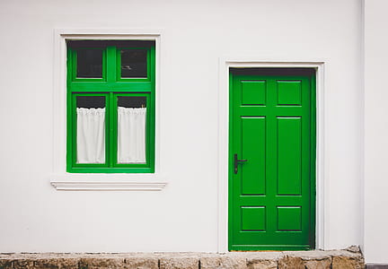 closed green wooden 6-panel door thumbnail