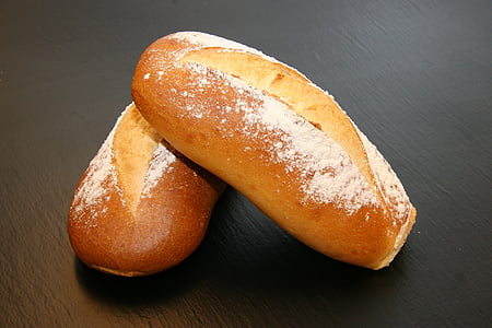 two baked breads with powders on gray surface thumbnail