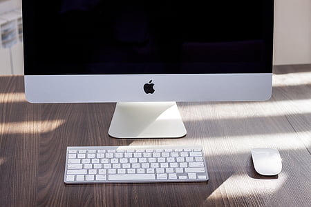 silver iMac near Apple Wireless Keyboard and Apple Magic Mouse thumbnail