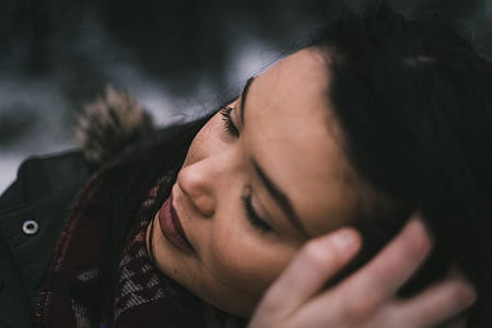 closeup photo of woman wearing black top thumbnail