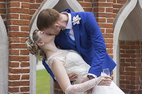 photo of man and woman kissing each other on their wedding day thumbnail