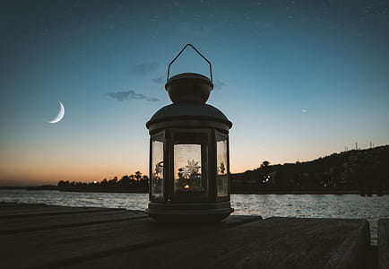 Gray Metal Candle Lantern on Boat Dock thumbnail