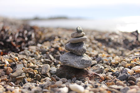 selective focus photography of stacked stones thumbnail