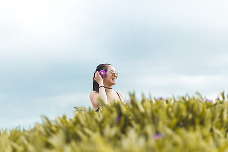 woman wearing black top under white sky at daytime thumbnail