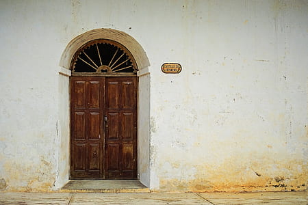 closed brown wooden 6-panel French doors thumbnail