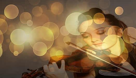 bokeh photography of woman playing violin thumbnail