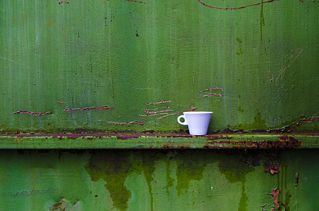white ceramic teacup on shelf thumbnail