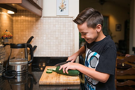 Kid Helping In Kitchen Photo thumbnail