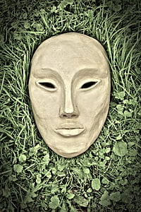 brown concrete mask on green grass thumbnail