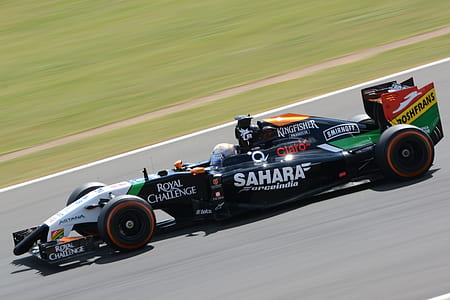 person riding formula 1 car on road thumbnail