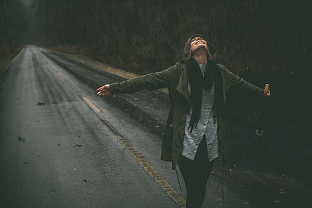 woman wearing jacket standing in the middle of the road thumbnail