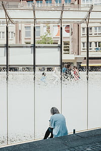 woman sitting on staircase using phone thumbnail