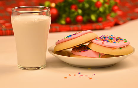 milk beside cookies on white plate thumbnail