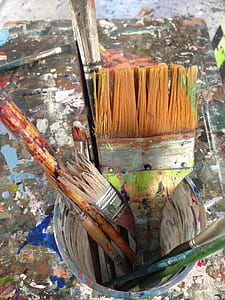 assorted paint brushes in plastic pail thumbnail