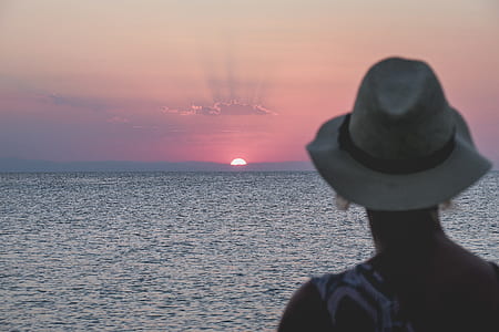 woman facing sun during golden hour thumbnail