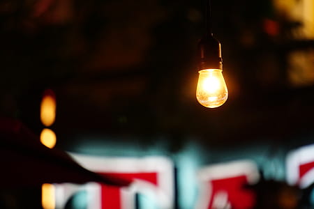 photo of light bulb under brown ceiling thumbnail